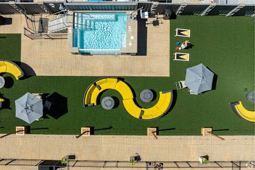 an aerial view of a swimming pool with umbrellas at 1400 Russell Apartments, Saint Louis, MO, 63104