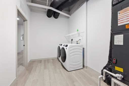 a washer and dryer in a room with a door