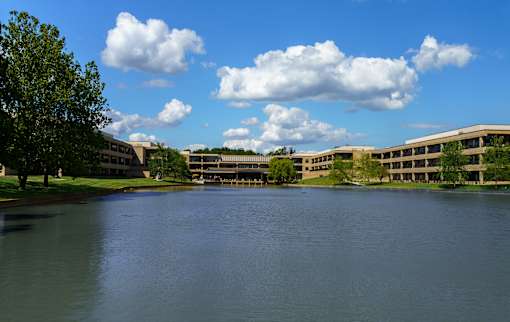 A large body of water in front of a building. at The Residences at Tesson Ridge Apartments, Saint Louis, 63128