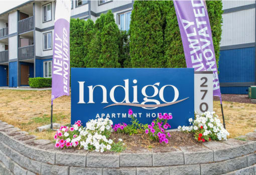 an image of the indigo apartment homes sign in front of the building