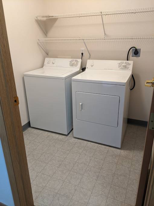 a laundry room with a washer and dryer