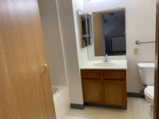 a bathroom with a sink toilet and bathtub