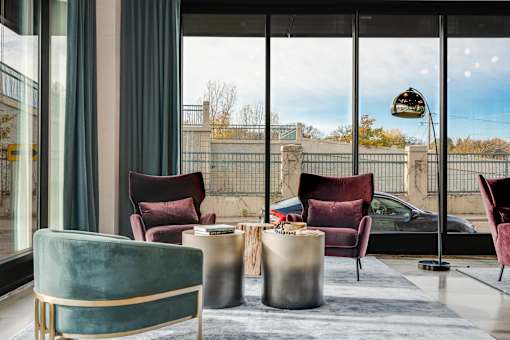 A modern room with a view of the outside through large windows. at The Shale, Minnesota