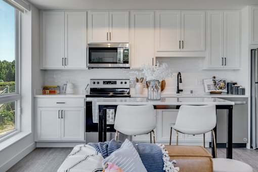 kitchen with white cabinets at The Shale, Minnesota, 55406