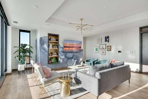 modern room with gold floor lamp at The Shale, Minneapolis, 55406