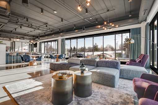 A modern room with a large window at The Shale, Minneapolis, MN 55406