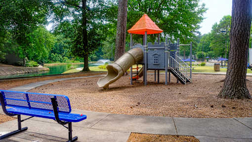 Our playground with a slide and a climbing structure in a park