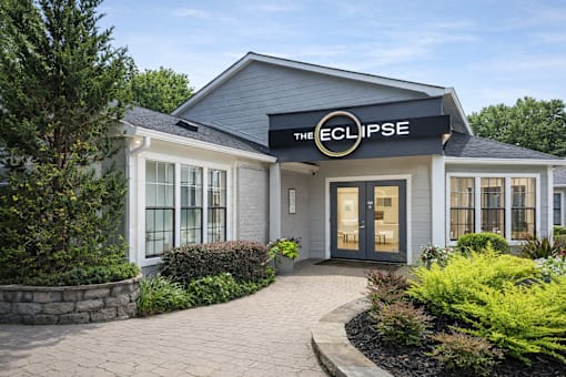 The Eclipse building has a black roof and a stone wall.