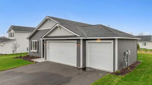 A two-car garage is attached to a house.