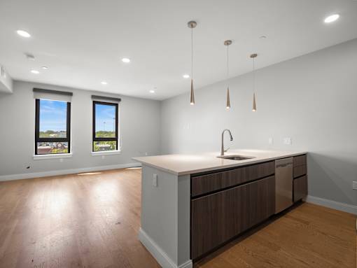 A kitchen with a sink and a window.