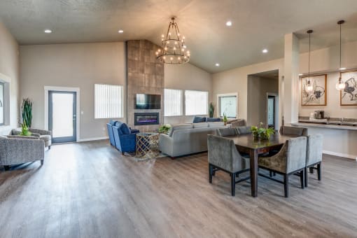 a living room with couches and chairs and a table