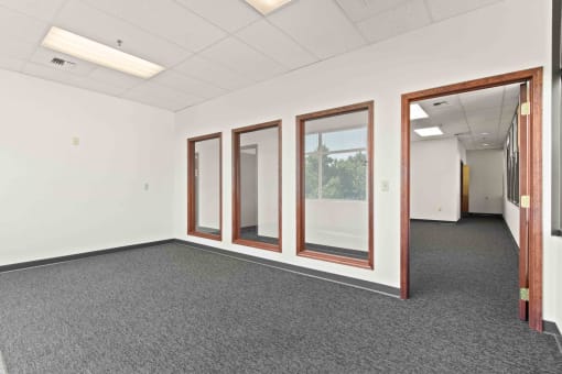 this office space is empty and has windows