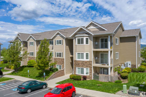 country vista at liberty lake apartment building with cars parked in front of it