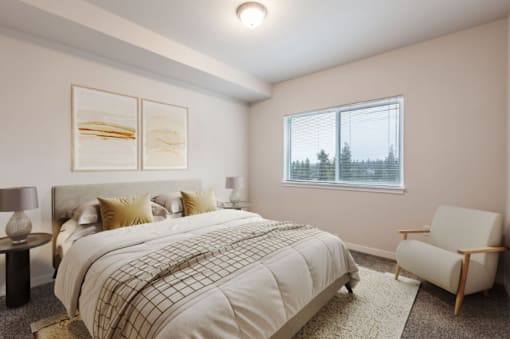 A bedroom with a large bed and a chair.