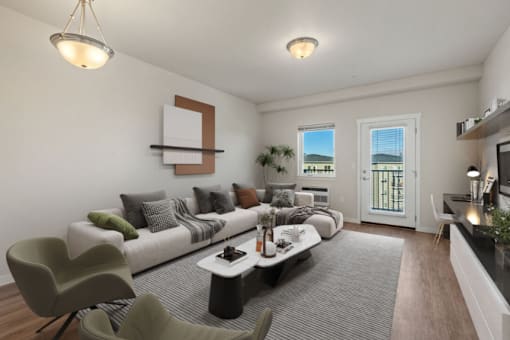 A living room with a white couch, a coffee table, and a chair.