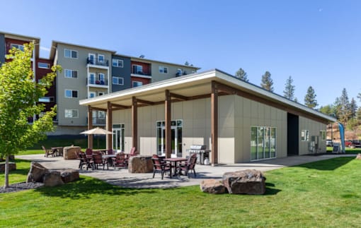 A building with a covered patio area in front of it.