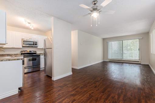 a kitchen and living room in a 555 waverly unit