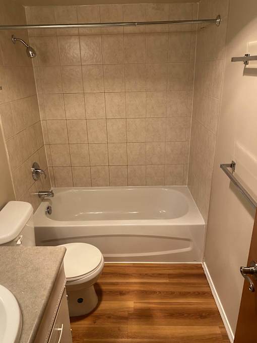 a small bathroom with a toilet and a bathtub