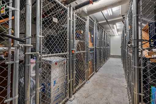 A long corridor with metal fences on both sides.