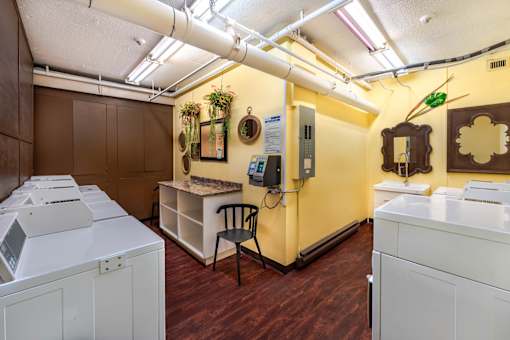 A laundry room with washers and dryers.
