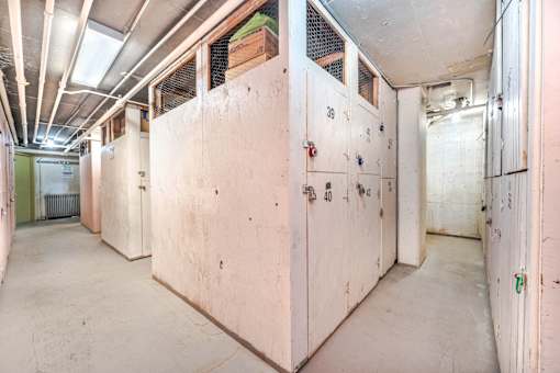 A long hallway with white walls and doors labeled 38, 40, and 42.