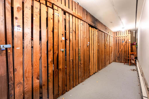 A room under construction with wooden studs on the walls.