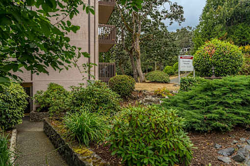 A building with a garden in front of it.