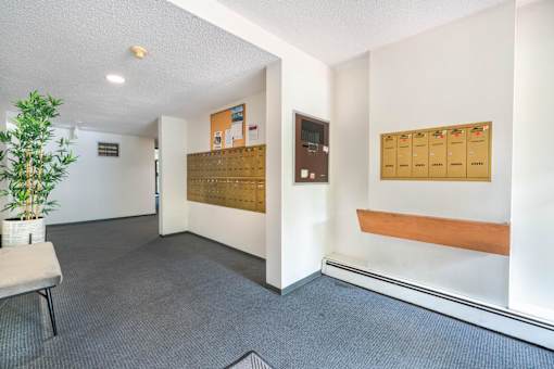 A room with a white wall and a brown board on it.