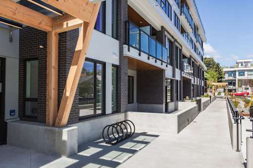 A modern building with a wooden beam structure on the side.