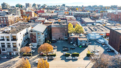 A cityscape with buildings and cars.