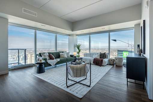 A living room with a view of the city.