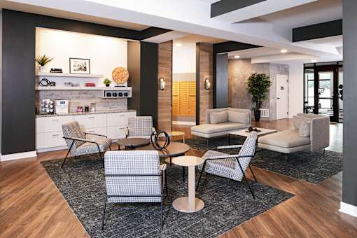 a living room with couches and chairs and a table