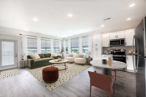 A modern kitchen with a dining table and chairs.