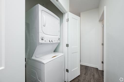 A white dishwasher and oven in a kitchen.