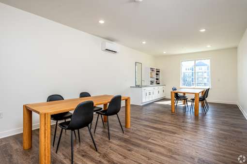 A room with a table and chairs.