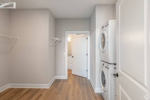 A laundry room with a washer and dryer in it.