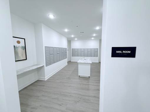 A white room with a sign that says "Mail Room".