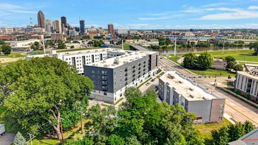 Aerial view of modern apartment building and cityscape 1 at Union at Rivers Edge Apartments, Des Moines