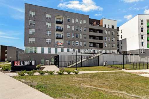 Multi story apartment building with exterior staircase at Union at Rivers Edge Apartments, Iowa
