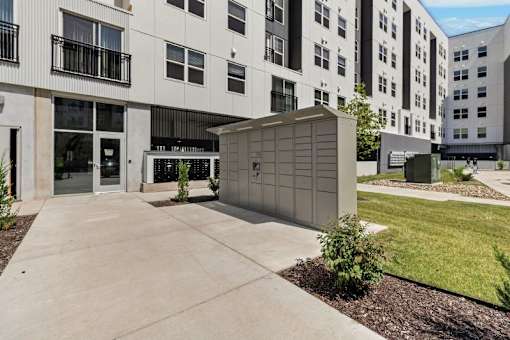 Package locker station and building entrance at Union at Rivers Edge Apartments, Des Moines, Iowa