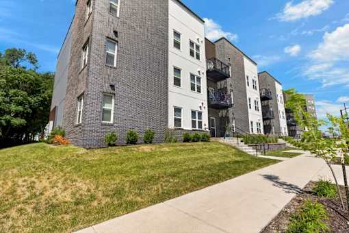 Contemporary apartment building with balconies and lawn 1 at Union at Rivers Edge Apartments, Des Moines, Iowa