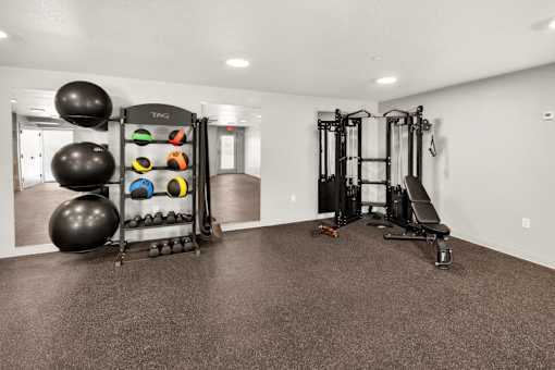 Fitness center with exercise equipment and storage 1 at Union at Rivers Edge Apartments, Iowa, 50315