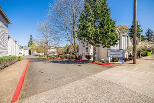 A street view of a residential area with a sign for "Bank of America".