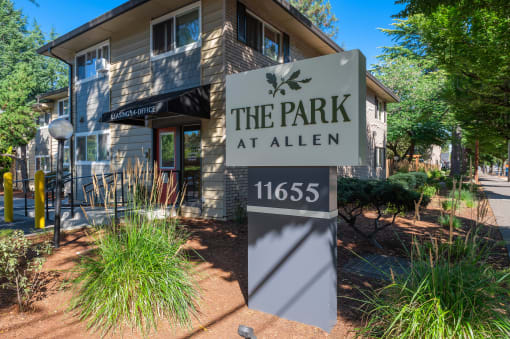 the park at allen sign in front of a building