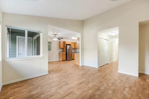 A room with wooden floors and white walls.