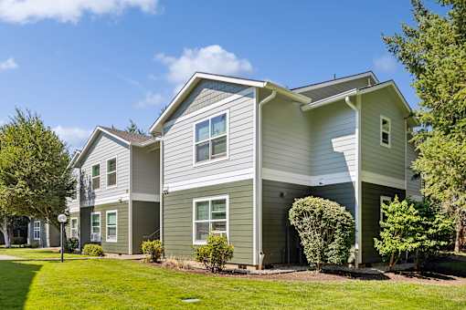 A two-story house with a grey and white exterior.