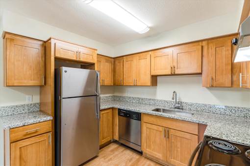 Cascade Woods kitchen area with fridge and dishwasher