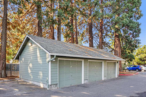 A two-car garage is located in a driveway.