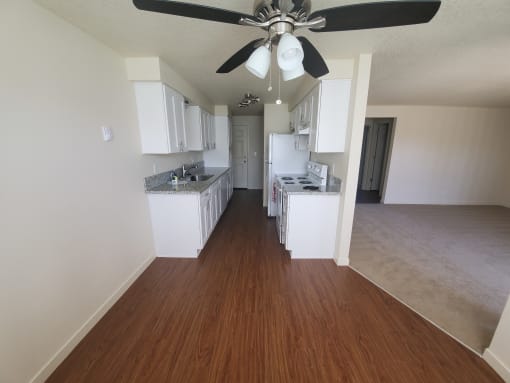 a view of the kitchen and living room from the dining room