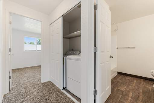 A small white bathroom with a toilet and a sink.